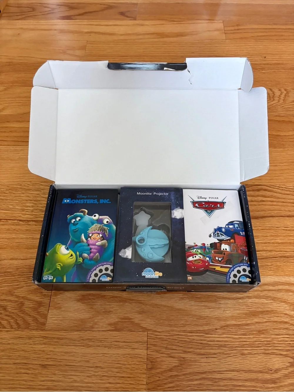 Moonlite Projector with Disney Pixar Story Reels - Blue